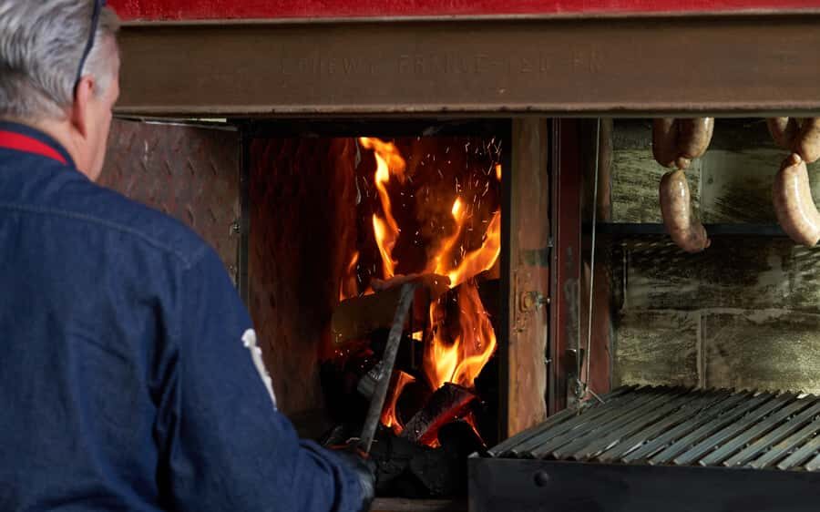 Buenos Aires: Join a Local Family for an Argentine Barbecue - Front-Row Parrilla Views: The 3-Hour Rhythm of Wines, Stories, and 8 Grilled Courses